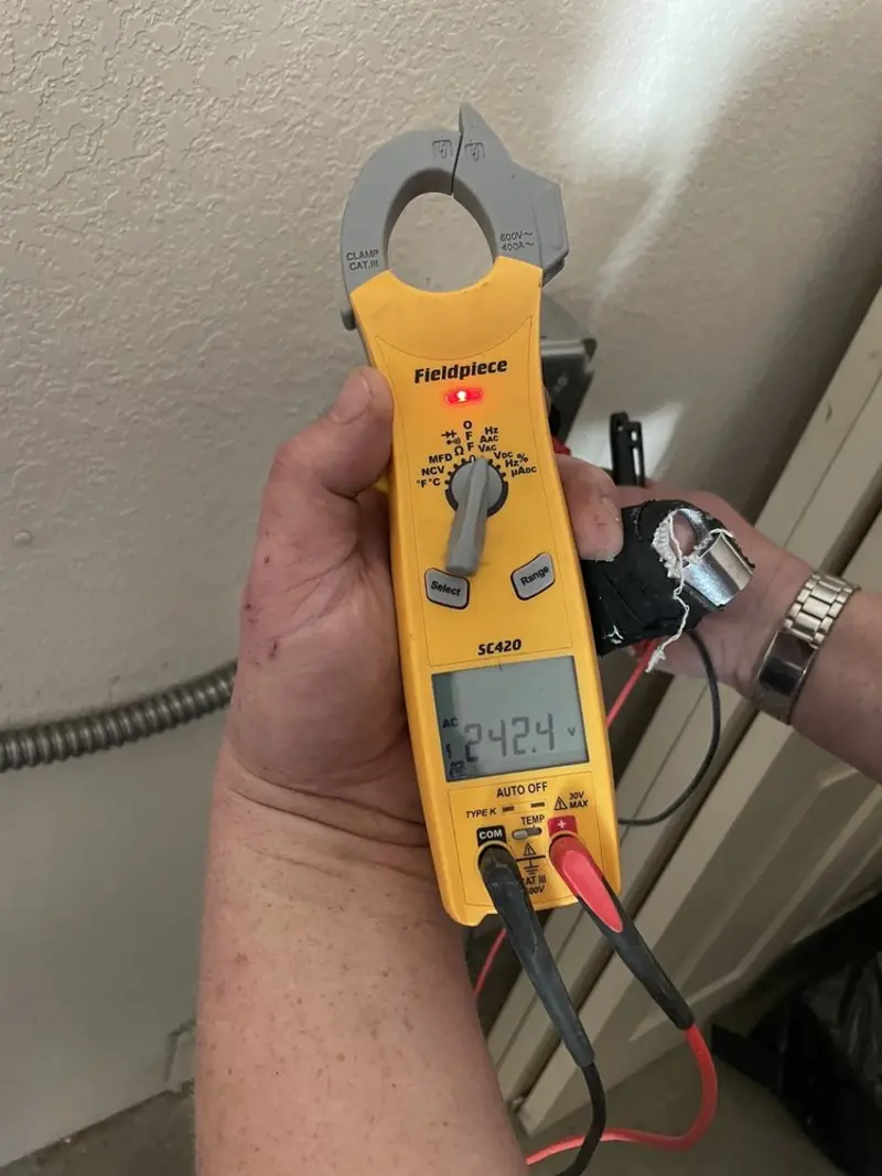 Voltage testing with clamp meter during Electrical Installation Services in Green
